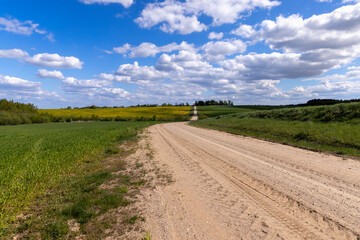 unpaved road in rural areas in spring, unpaved road © rsooll