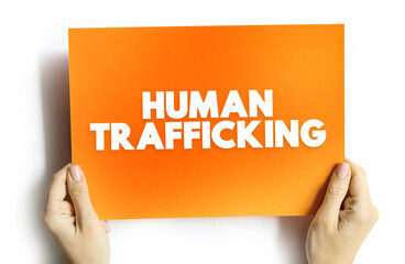 Fototapeta Human Trafficking is the trade of humans for the purpose of forced labour, text concept on card for presentations and reports obraz
