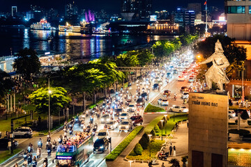 View of Me Linh roundabout with heavy traffic near Bach Dang waterbus station port and Saigon river...