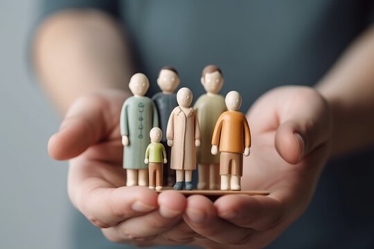 Family bonding through play: Miniature doll toy family cradled in human hands. A heartwarming love, protect, family insurance and secure concept, capturing the essence of care, and connection.