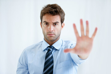 Businessman, portrait and hands stop for wait, no or halt in gesture, protest or take a stand at office. Man, male person or employee show palm for negative sign, disapproval or disagree at workplace