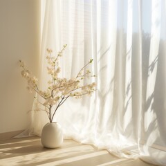 White vase with delicate flowers by a sunlit window draped with sheer curtains, creating serene ambiance