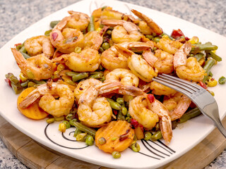 shrimp, stir fried vegetables and shrimps on plate