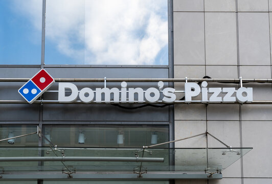 Domino's pizza restaurant logo sign. American multinational pizzeria restaurants chain. Signage with brand logotype on November 1, 2023 in Krakow, Poland.