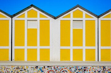 Colorful yellow beach huts in Senigallia, Adriatic sea, Italy. - obrazy, fototapety, plakaty