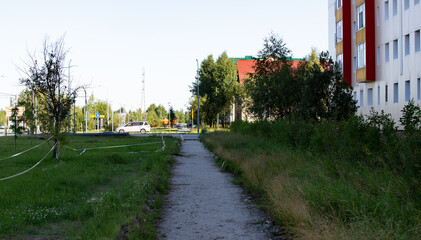 Repair of the road in the center of the city of Noyabrsk on Yamal in summer in 2023