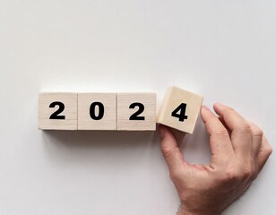 2024 Happy New Year eve wooden blocks flip change hand, countdown starting ending 2023, action schedule calendar strategy future vision, business startup plan resolution, celebration