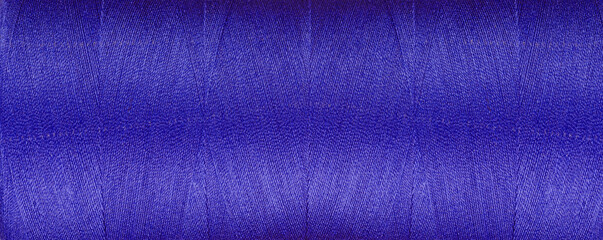 texture of thread for a sewing machine purple colors on a white background