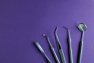 Dentist tools. Professional steel dental instruments with background with free space.