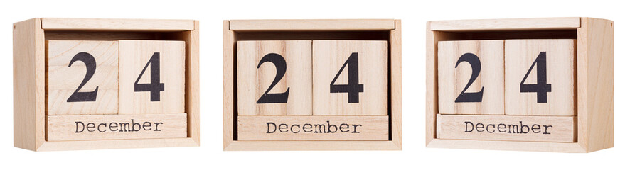 Wooden calendar, a set of dates of the month 24 December, on a white and transparent background close-up