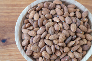 Almond kernel in a bowl. Background view from above. Healthy food