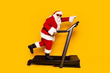 Full length profile portrait of excited grandfather santa hurry rush treadmill slimming new year...