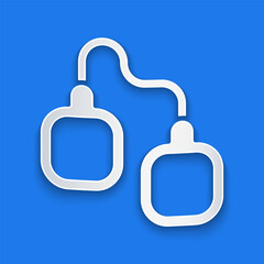 Paper cut Handcuffs icon isolated on blue background. Paper art style. Vector