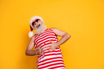 Photo of funny cheerful elderly guy wear new year swimsuit hat sunglass laughing empty space...