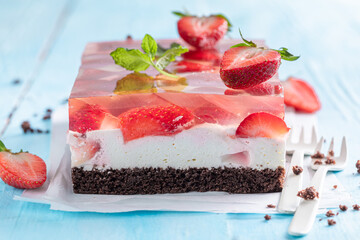Delicious jelly cake with strawberries an airy sponge cake.