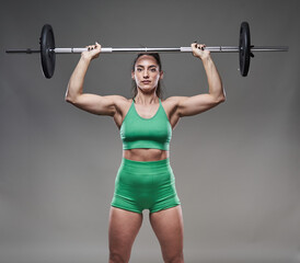 Fitness model lady doing barbell exercises