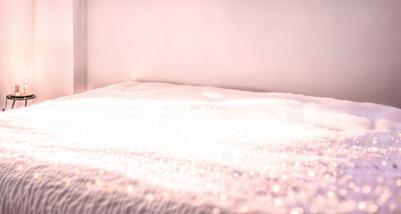 A cozy bedroom with soft light, covered with a sparkling bedspread, creating an atmosphere of relaxation and comfort, ideal for advertising home textiles or cozy evening products. Generative AI