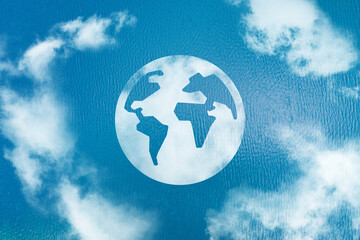 Naklejka premium Planet sign in the ocean created from clouds.