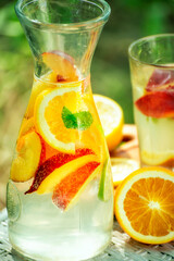 summer refreshing drink made from fruit. Lemonade in the garden.