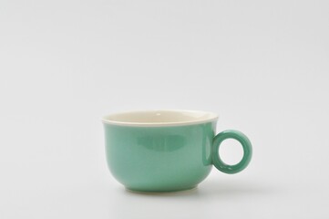 Turquoise  ceramic mug isolated on white background