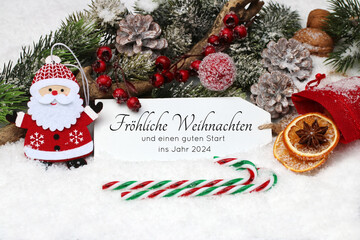 Weihnachtskarte: Label mit Weihnachtsgruß im Schnee mit Weihnachtsmann, Zuckerstange und Zweigen...
