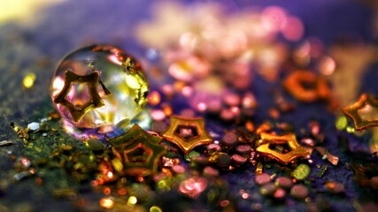 Drop of water background with glitter and glowing lights