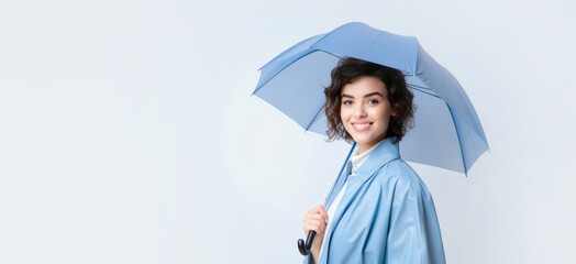 Beautiful young woman with blue umbrella on white background - obrazy, fototapety, plakaty