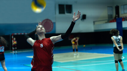 young woman volleyball player at match