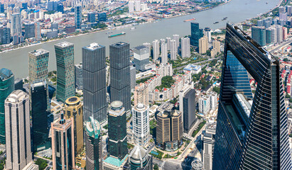Aerial shot overlooking the modern buildings and skyscrapers in the financial district of Shanghai, a megacity in the economic superpower that is China