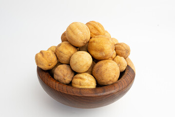 yellow dry lemon in a wood dish isolated on a white background
