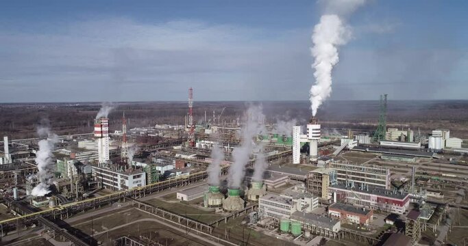 Chemistry Factory in Lithuania, Achema in Jonava City. Clear Blue Sky and Smoke Stacks in Background. Drone