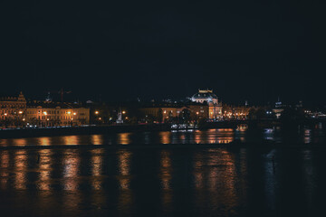 Fototapeta na wymiar Night view of Prague's Old Town and the National Theater from Charles Bridge.