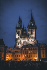 Fototapeta na wymiar Castle in Prague during the night with a crowd in front of it. 