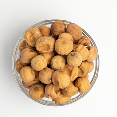 Sun Dried Lime in a glass dish on a white background
