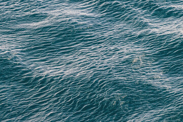Closeup, blue ocean in Patagonia. Rippled pattern from the wind. 
