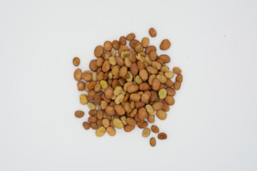 Dried fava beans on a white background
