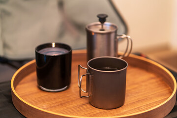 French press coffee brewing with candle