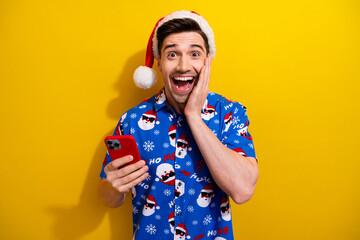 Photo of young guy wear new festive blue shirt hand cheek surprised snowing weather forecast...