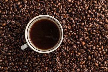 background with coffee beans and cup 