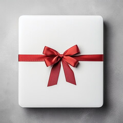 white gift box with red ribbon on white 