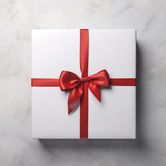 white gift box with red ribbon on white 