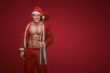 Smiling Santa with a barbell, fitness during the holidays theme