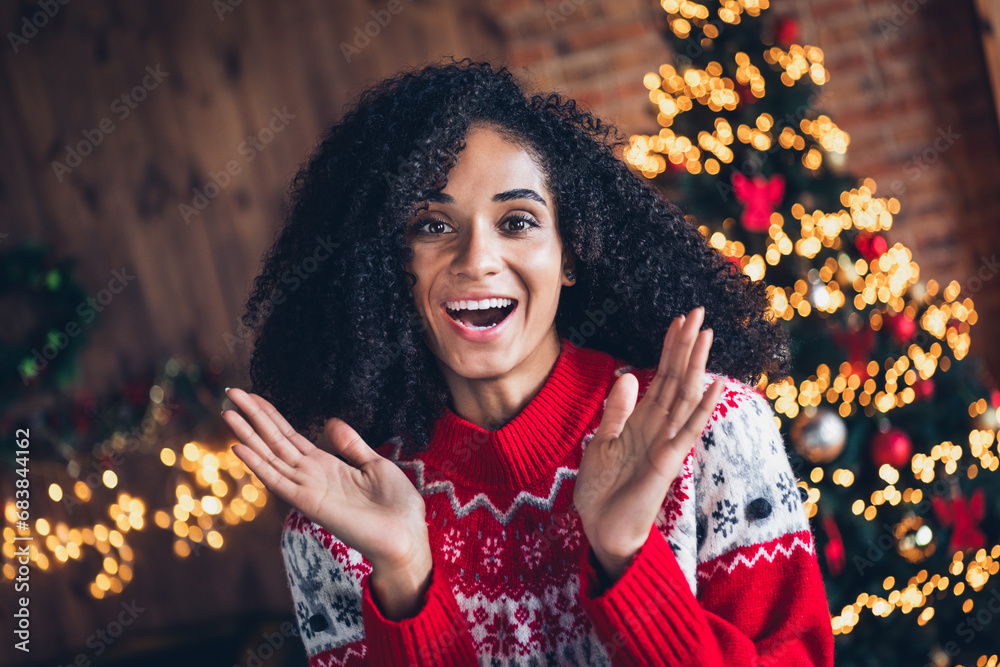 Sticker Portrait of funky cheerful astonished girl raise opened arms christmas time illumination apartment inside