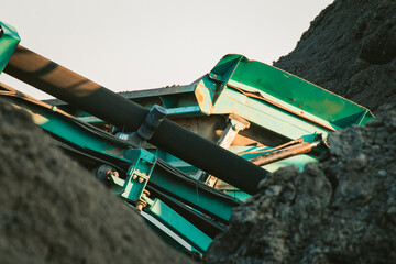 Building machine in construction site in turquoise colour