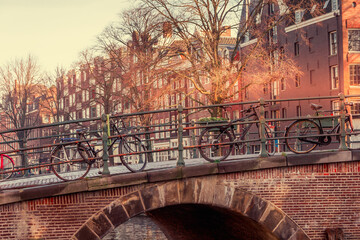 View of an Amsterdam canal and bicycles - obrazy, fototapety, plakaty