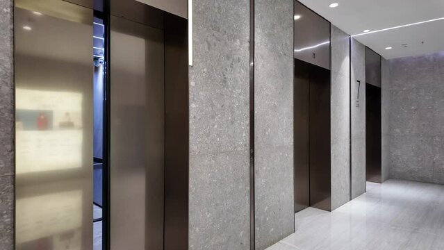 Opening the door of the office elevator