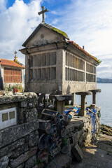 Fishing village of Combarro with the typical horreos (fish drying sheds). Galicia, Spain.