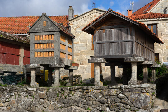 COMBARRO, SPAIN - OCTOBER 25, 2021: Fishing village of Combarro with the typical horreos (fish drying sheds). Galicia, Spain.