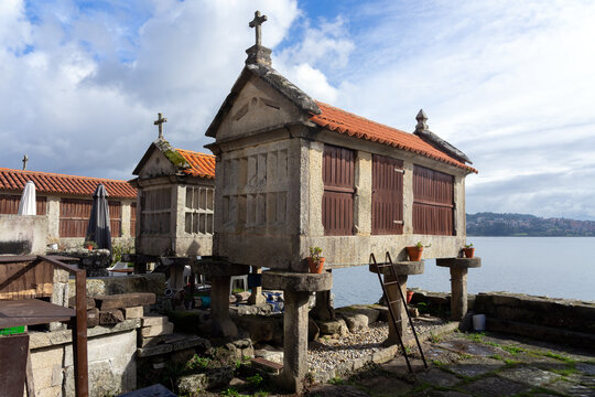 Fishing village of Combarro with the typical horreos (fish drying sheds). Galicia, Spain.