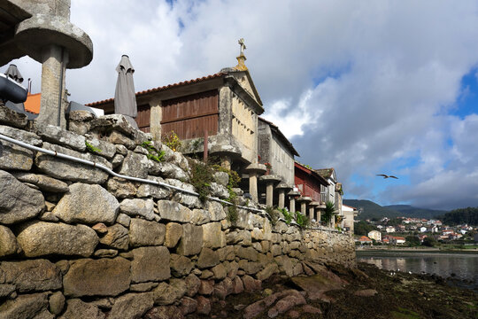 Fishing village of Combarro with the typical horreos (fish drying sheds). Galicia, Spain.